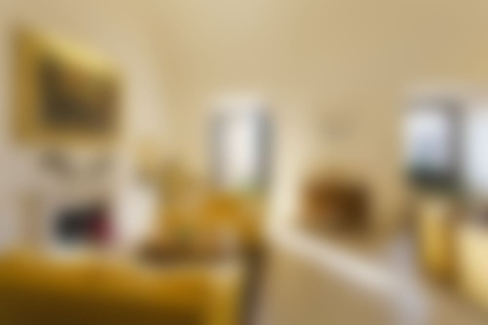 The impressive dining and living area with decorative fireplace.